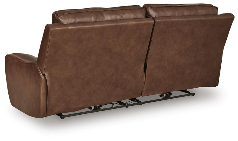 Ashley Furniture DeepWakes reclining living room set with plush fabric, featuring a sofa with padded armrests and reclining seats.