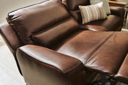 Ashley Furniture DeepWakes reclining living room set with plush cushions and wide armrests, shown in a modern living room setting.