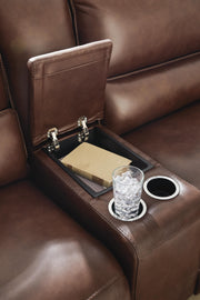 Ashley Furniture DeepWakes reclining sectional with storage console, featuring plush cushions and a built-in center console.