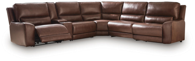 Ashley Furniture DeepWakes reclining sectional with storage console, featuring plush cushions and modern design in a spacious living room setting.