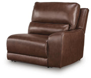 Ashley Furniture DeepWakes power reclining sectional with chaise, shown from an angle, highlighting plush upholstery and modern design.
