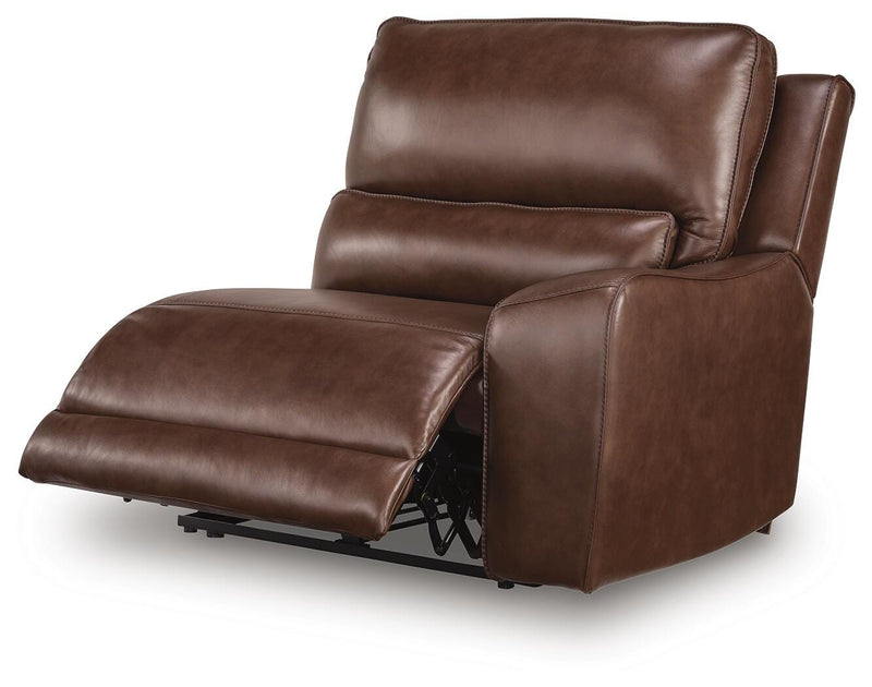 Ashley Furniture DeepWakes reclining sectional with storage console, shown from an angled open view highlighting the seating and storage features.