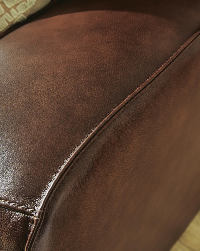 Ashley Furniture DeepWakes reclining sectional sofa chaise with plush upholstery and detailed welt stitching.