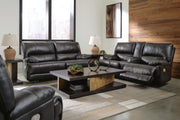 Ashley Furniture Mountainous Living Room Set featuring a sofa and armchair with plush cushions and rustic mountain-inspired design.