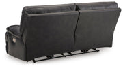 Back view of Ashley Furniture Mountainous Living Room Set, showing plush sofa cushions and contemporary design details.