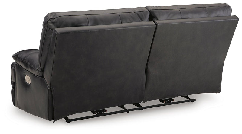 Back view of Ashley Furniture Mountainous Living Room Set, showing plush sofa cushions and contemporary design details.