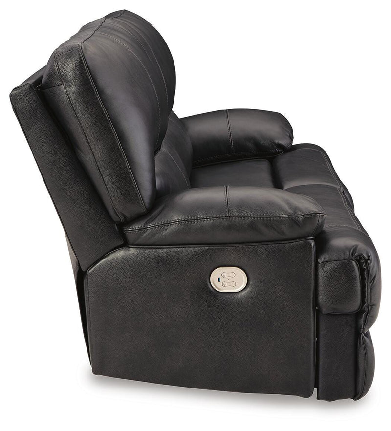 Ashley Furniture Mountainous Living Room Set featuring a sofa and armchair with plush cushions and mountain-inspired design details.