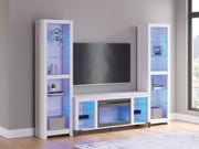 Ashley Furniture Brollevi entertainment center with blue finish, featuring open shelves and storage compartments for media devices.
