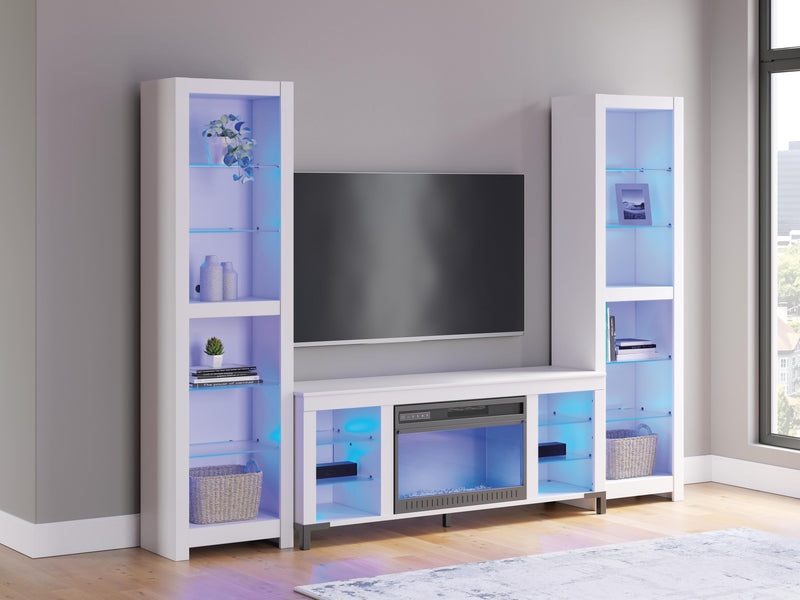Ashley Furniture Brollevi entertainment center with blue finish, featuring open shelves and storage compartments for media devices.