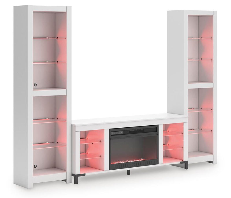Ashley Furniture Brollevi entertainment center with wood finish, open shelves and cabinet storage, shown from an angled view.