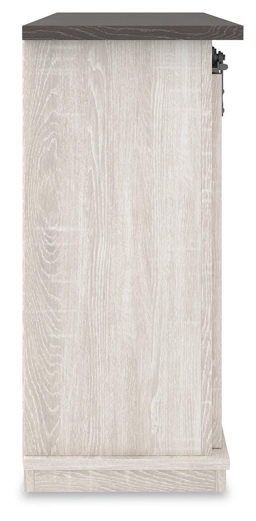 Ashley Furniture Dorrinson 54-inch TV stand with open shelves and storage compartments, crafted in a modern wood finish.