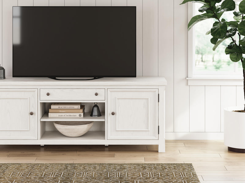 Robbinsdale 72-inch TV stand by Ashley Furniture with open shelving and storage cabinets, finished in a dark wood tone.