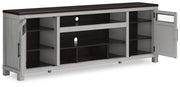 Ashley Furniture Darborn 88-inch TV stand with open shelving and storage compartments, modern wood finish, angled view.