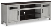 Ashley Furniture Darborn 88-inch TV stand with open shelving and storage compartments, shown from an angled view.