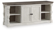 Ashley Furniture Havalance 67-inch TV stand with open shelves and closed cabinets, shown from an angled view.