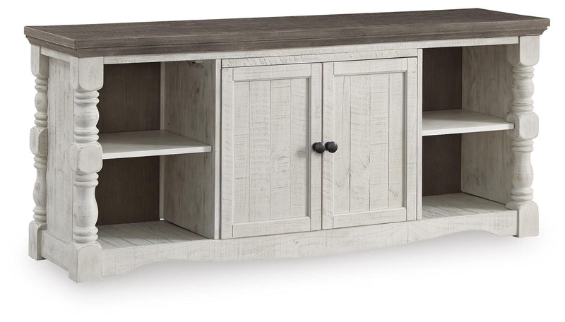 Ashley Furniture Havalance 67-inch TV stand with open shelves and closed cabinets, shown from an angled view.