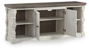 Ashley Furniture Havalance 67-inch TV stand with open shelving and a modern design, shown from an angled view.