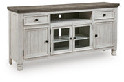 Ashley Furniture Havalance TV Stand with open shelves and closed cabinets, angled design in dark wood finish.