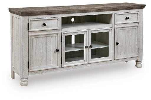 Ashley Furniture Havalance TV Stand with open shelves and closed cabinets, angled design in dark wood finish.