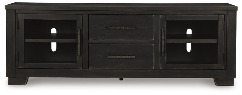 Ashley Furniture Galliden 80-inch TV stand with wood finish and modern design, featuring open shelves and storage compartments.