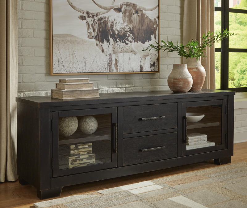 Ashley Furniture Galliden 80-inch TV stand with open shelving and storage drawers, crafted in a modern wood finish.
