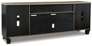 Ashley Furniture Foyland 83-inch TV stand with open shelves and storage cabinets, finished in a warm wood tone.