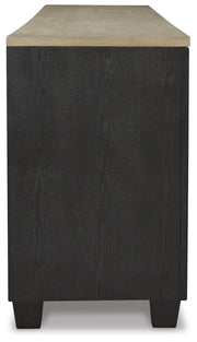Ashley Furniture Foyland 83-inch TV stand with open shelves and storage cabinets, made of dark wood with sleek modern design.